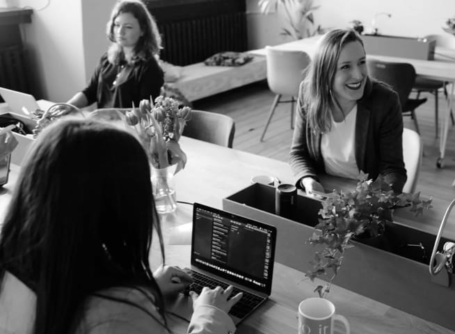 women working on laptops